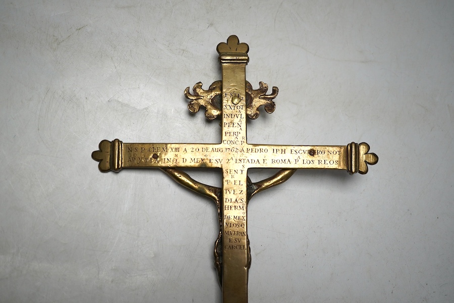 An 18th century Spanish bronze crucifix commemorating the papal visit of Pope Clementine XIII in 1762, 33.5cm long. Condition - fair